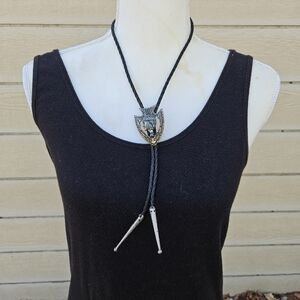 silver tone bolo tie black leather cord arrowhead shape with head in profile
